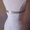 Back of white and golden wedding gown