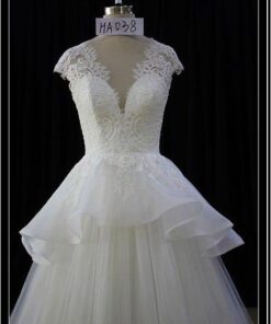 Darius Cordell close peplum style cap sleeve wedding gown