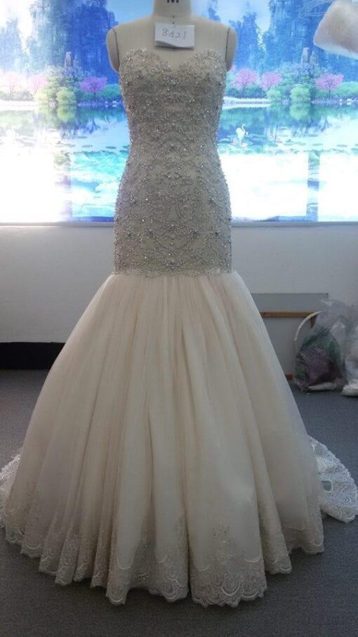 Style# Straplessfit and flarebridalgownwithdensebeadedlacefromDariusCordellCoutureBridalFashionDdesigns