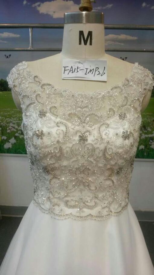 Style#FA IMPCapsleevebeadedbridalgownfromDariusCordellCoutureFashionDesigns