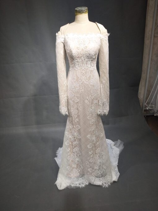 Elainne replica of a ester couture long sleeve lace wedding gown by Darius Cordell