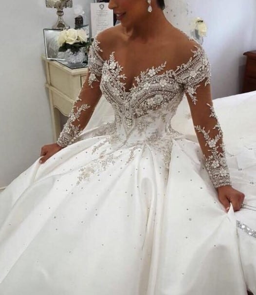 Off the shoulder long sleeve beaded bridal gown