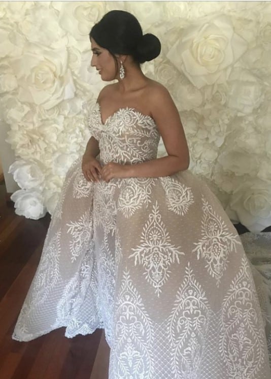 Ornate lace embroidery wedding gown with over skirt from Darius Bridal