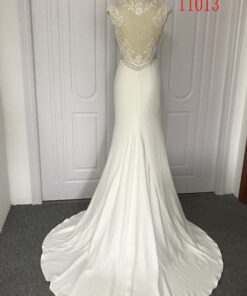 sheer backless wedding gown from Darius cordell