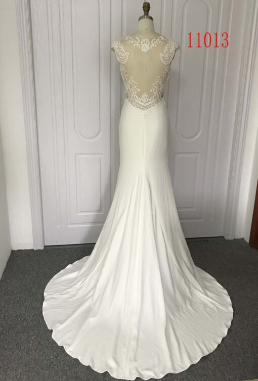 sheer backless wedding gown from Darius cordell